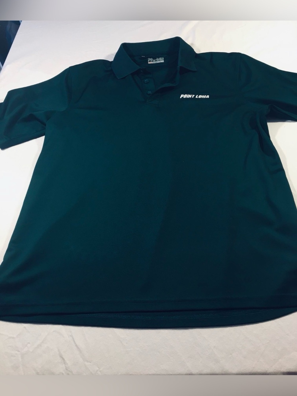 Men’s under armor polo green with Point Loma Nazarene University Logo size med